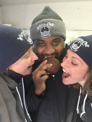 three people sharing a whoopie pie