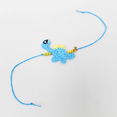 Hand Crochet Dino Rakhi - Blue