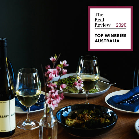 O'Leary Walker Wines Top Wineries of Australia 2020 award tile in top right hand corner, placed over shot of a dining time set with plates, flowers and two glasses of Riesling