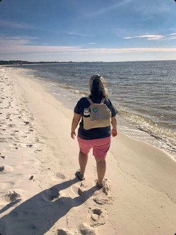 One of my customers is wearing her backpack on the beach