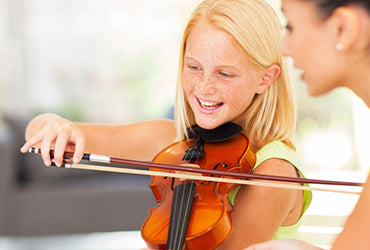 Learning to play the violin at a young age