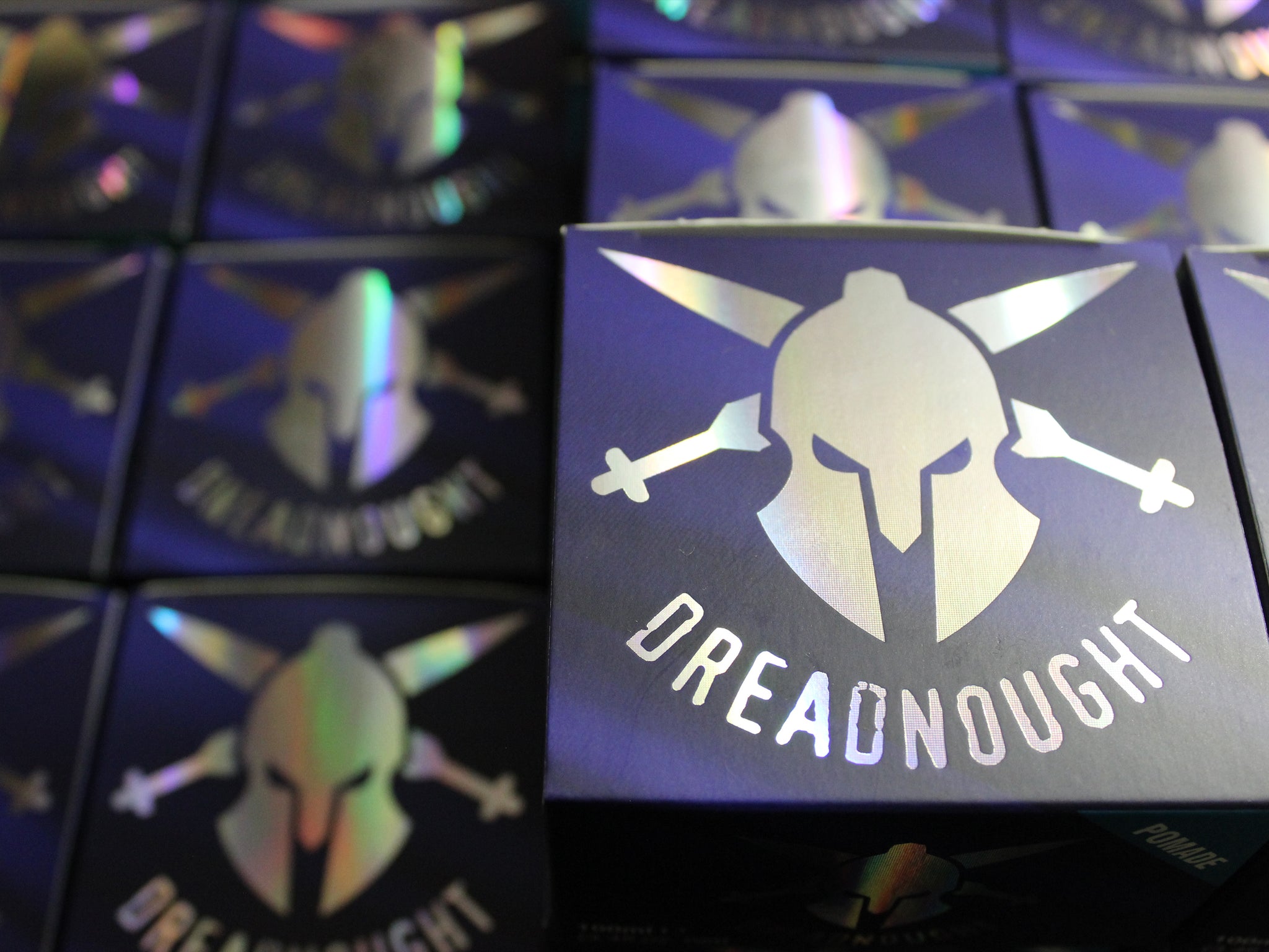 Photo of the Dreadnought Pomade with Matt Clay and Matt Paste in the background