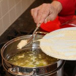 Spoon small portions of the mixture into the water (dip spoon into water after each dumpling)