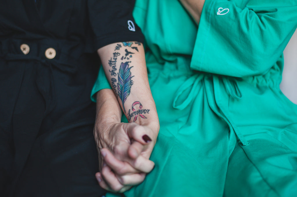 Breast cancer survivors holding hands