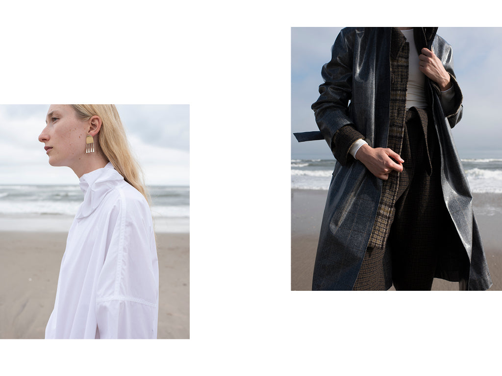 The first image is a cropped side view of a woman with blonde hair wearing a White cotton shirt by Sofie D'Hoore and brass earrings by Quarry. The second image is a front view crop of the same woman wearing a plaid shirt and pants by Creatures of Comfort along with a Plaid Trench by Hache.