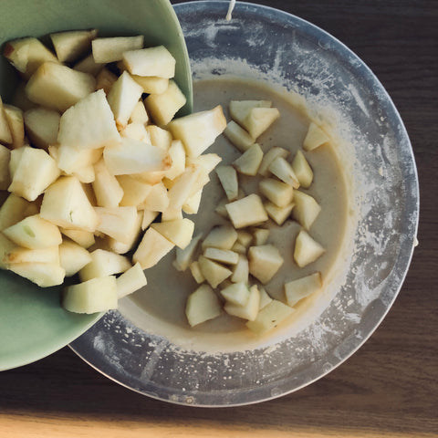 Add the cubed apples to the mixture