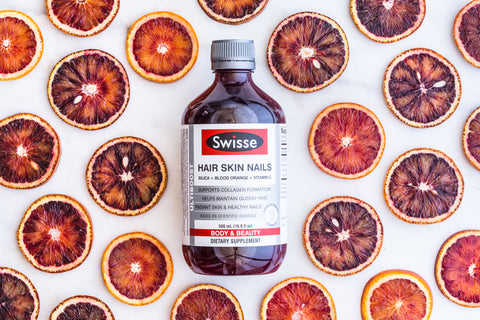 A bottle of Swisse Ultiboost Hair Skin Nails Liquid