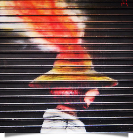 street art of a volcano in a hat reminds me of the mind-blowing alternative facts meme