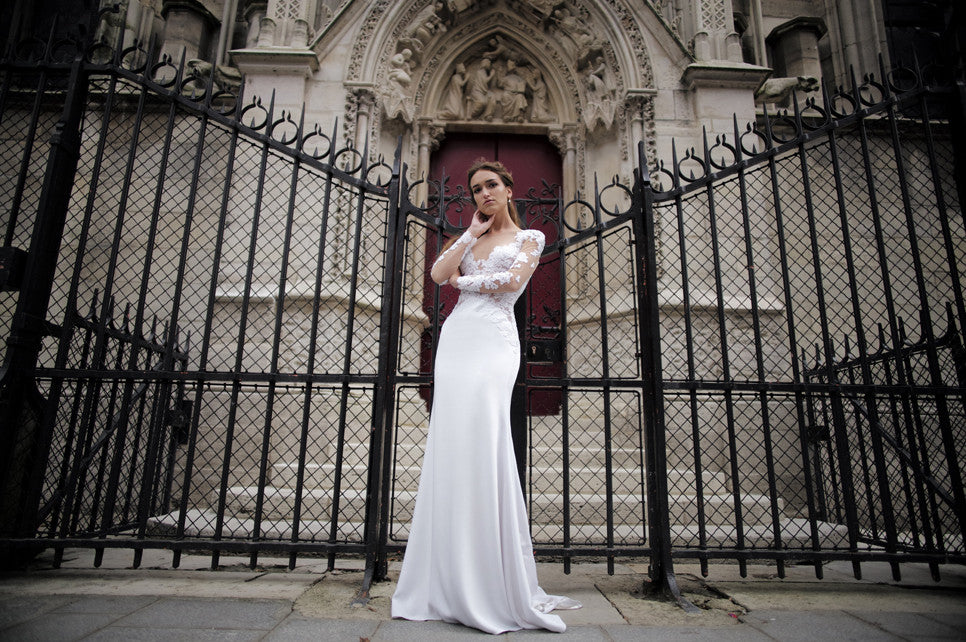 Claudia: Long sleeved Couture Bridal gown of French lace applique on nude mesh and a sleek heavy 6ply silk crepe skirt. Handmade in our Atelier on Russian Hill in San Francisco.