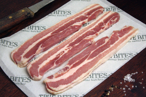 streaky bacon displayed on true bites greaseproof paper