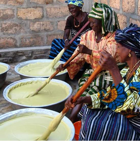women in Ghana working together to produce shea butter