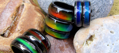 magnetic mood rings lying on a rock taken on the beach