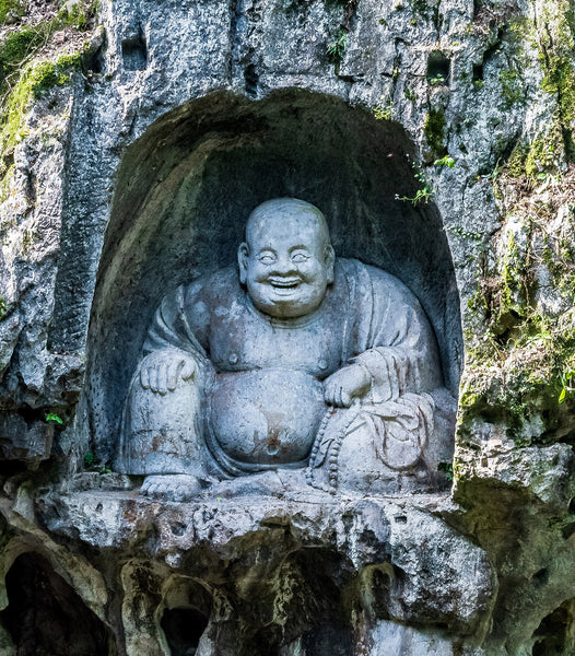 Le Bouddha rieur en statue
