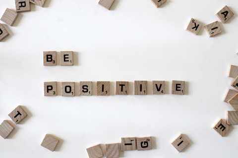 Scrabble tiles spelling Be Positive