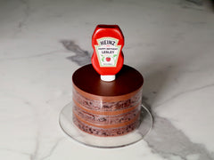 chocolate gluten free naked cake with a 3D fondant Heinz Ketchup bottle