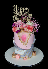 geode pink marble cake with macarons, gold and flowers