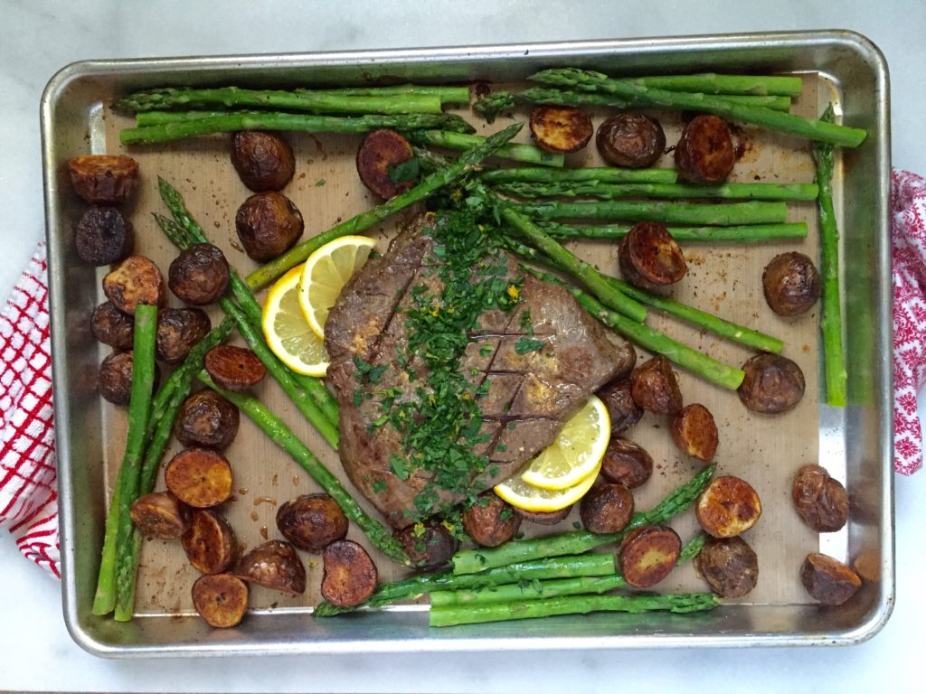 One-Pan London Broil dinner featuring steak, potatoes and asparagus