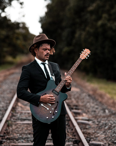 Ash Grunwald with his Signature Model Guitar