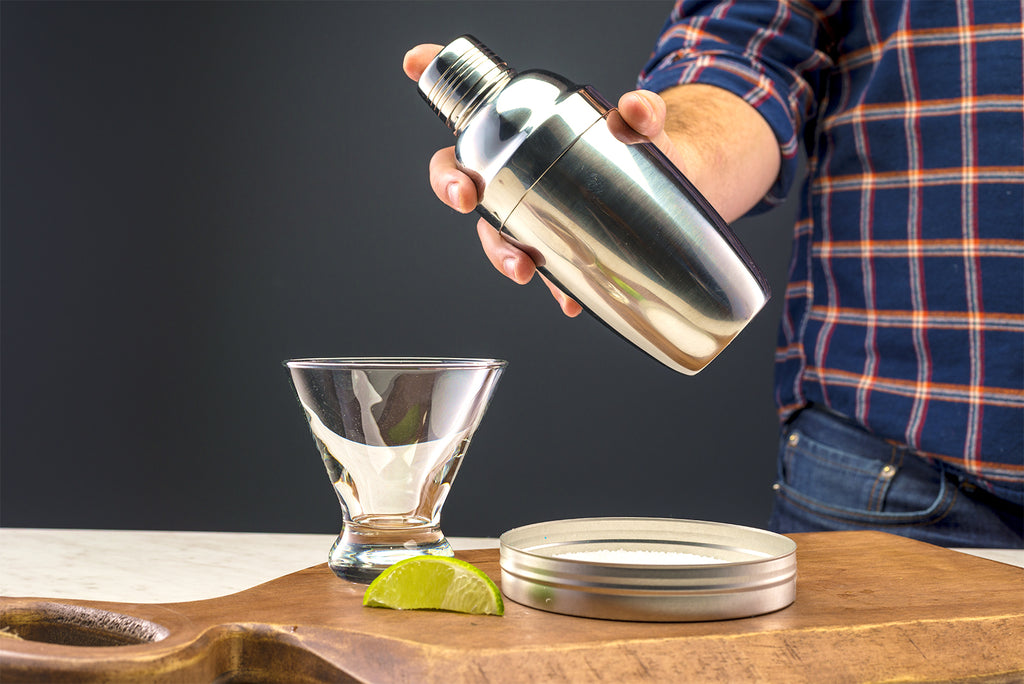 Person shaking a cocktail shaker