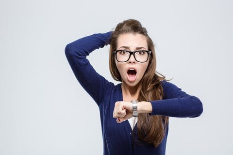 girl surprised at time after checking her watch