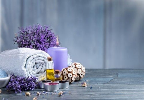 massage supplies wait on a wooden surface