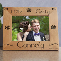 Wood Picture Frame for wide photos with Shamrocks and Swirls personalized with two names on top a last name on bottom and a date