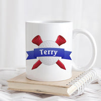 Golf Ball and 2 criss crossed tees with blue ribbon across ball and name in ribbon