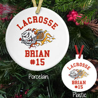 Flaming Lacrosse Ball holding a stick on a porcelain or plastic ornament personalized with any three lines of text.
