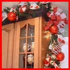 Christmas garlands over kitchen cabinets