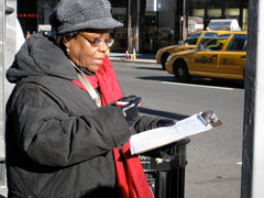 Senior person conducting a street survey. Noah Kazis
