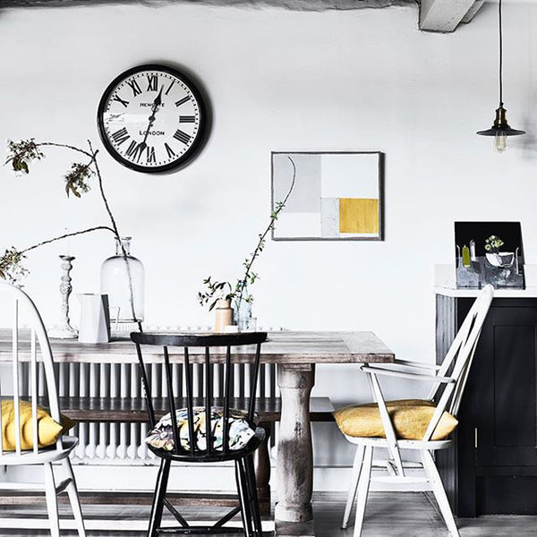 Coastal inspired dining room with industrial lights