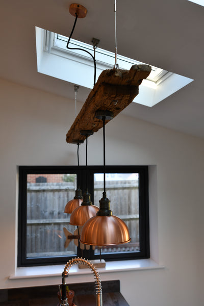 Copper retro lights in a renovated kitchen setting