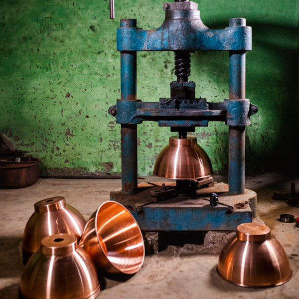 Industrial Cooper pendants being spun