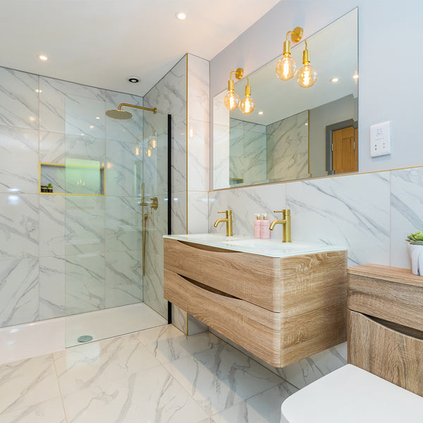 industrial brass wall lights in a sleek white and wood bathroom interior