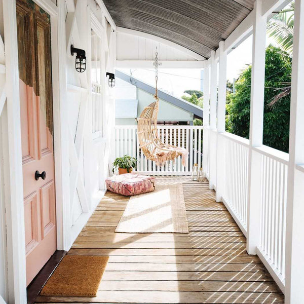 Pink door with industrial outdoor lights in Australia