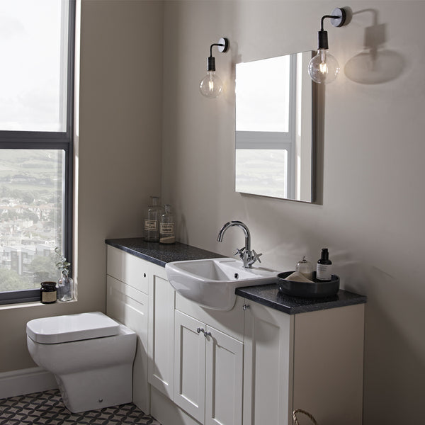 Neutral bathroom interior with pewter industrial wall lights