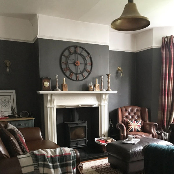 Grey living room interior with brass giant pendant light