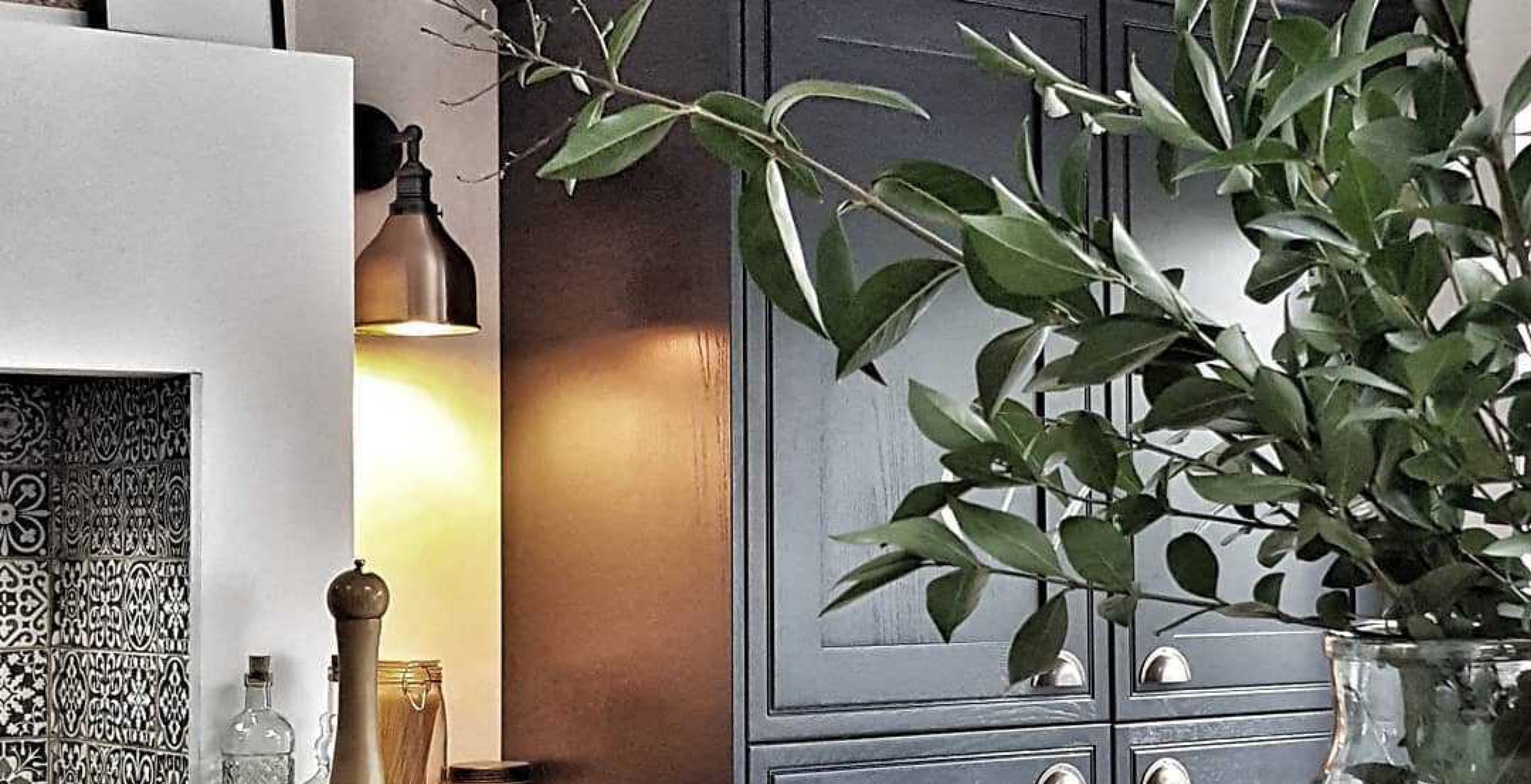 industrial style lights in a dark kitchen