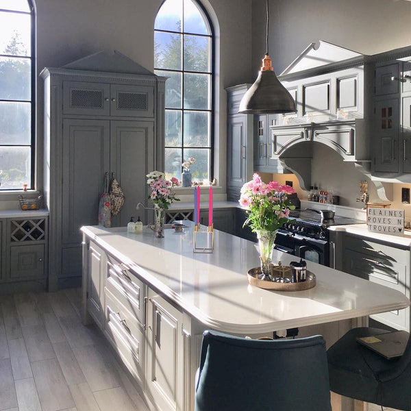 Grey kitchen decor with large windows and kitchen island