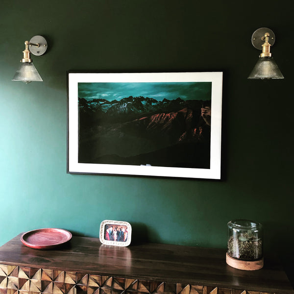 Emerald green interior with green painting and glass wall lights