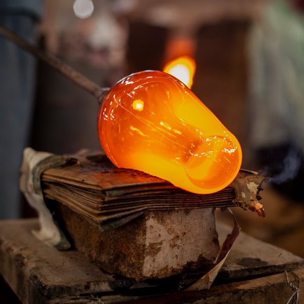 Glass light being formed in a UK factory