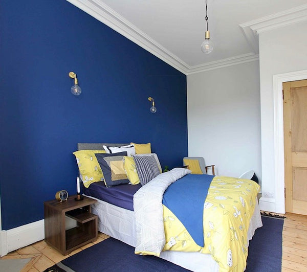 Bright blue and yellow bedroom interior decor