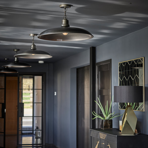 Grey hallway interior with industrial lighting