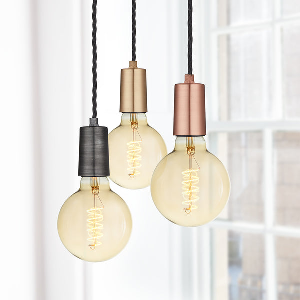 Exposed vintage bulb lights in pewter, copper and brass