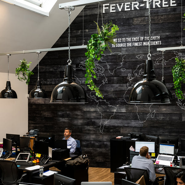 FeverTree office with black decor and black retro pendants