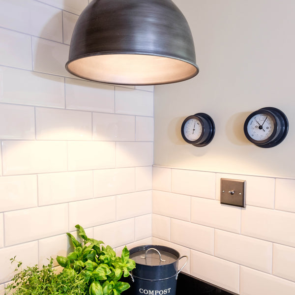 Industrial-style pendant in a kitchen interior with white tiles