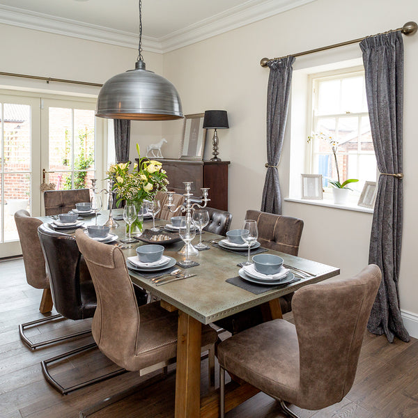 Dining room interior with giant pewter pendant light