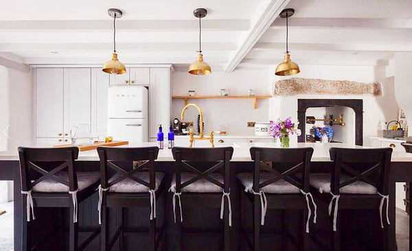 Kitchen interior design with trio of metallic lights