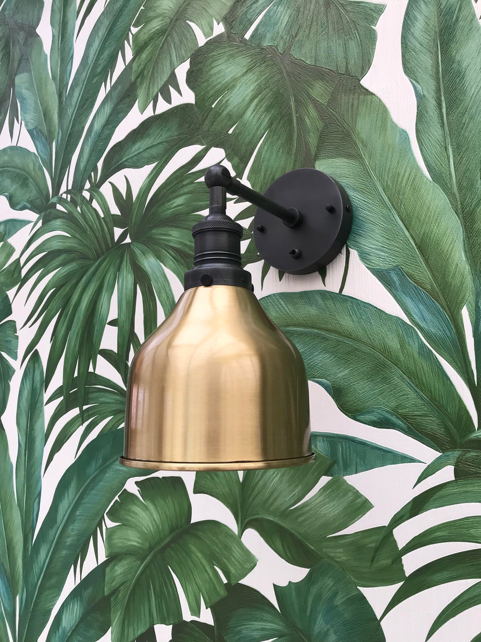 Tropical wallpaper with brass light