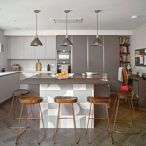 gray wooden kitchen with hanging industrial lights